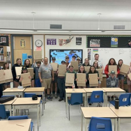 Students from F.E. Madill Secondary present their newly made bat boxes.